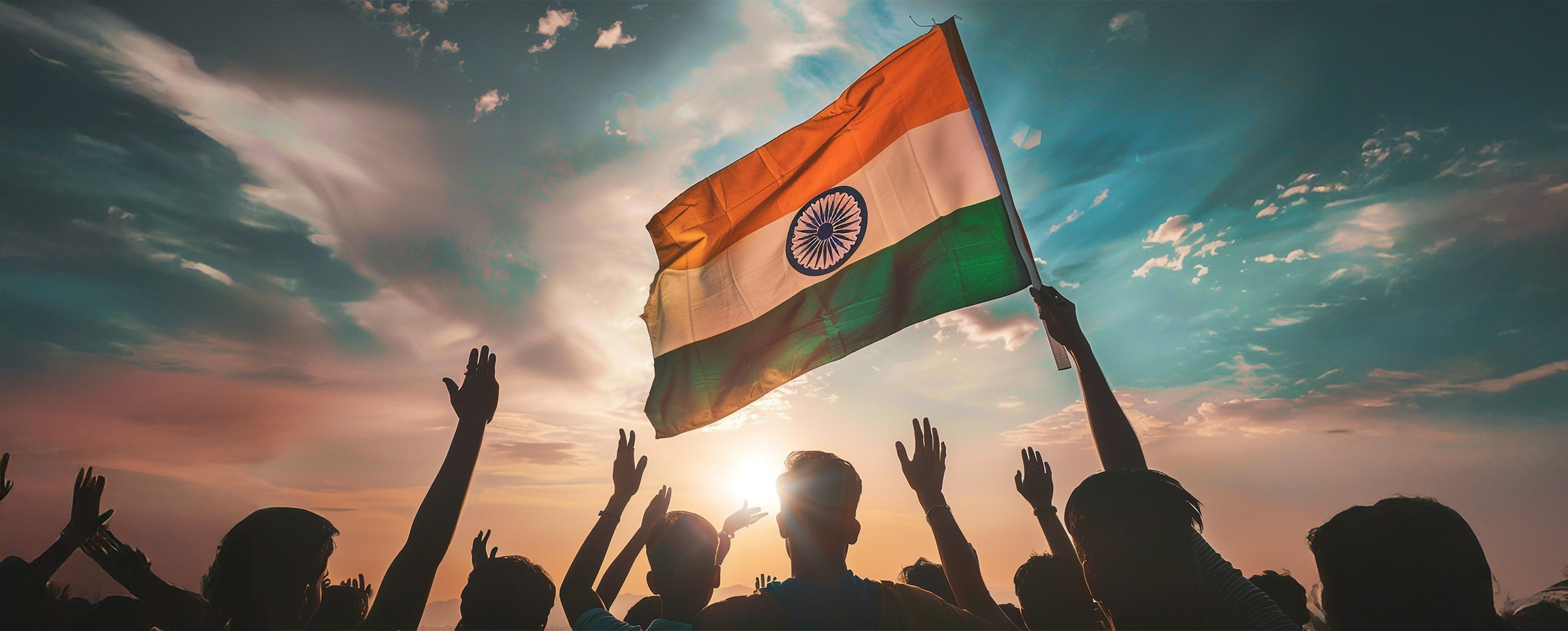 Group of people raising hands with the Indian national flag at sunset, symbolizing patriotism and celebration of Independence Day in India. Group of people raising hands with the Indian national flag at sunset, symbolizing patriotism and celebration of Independence Day in India.