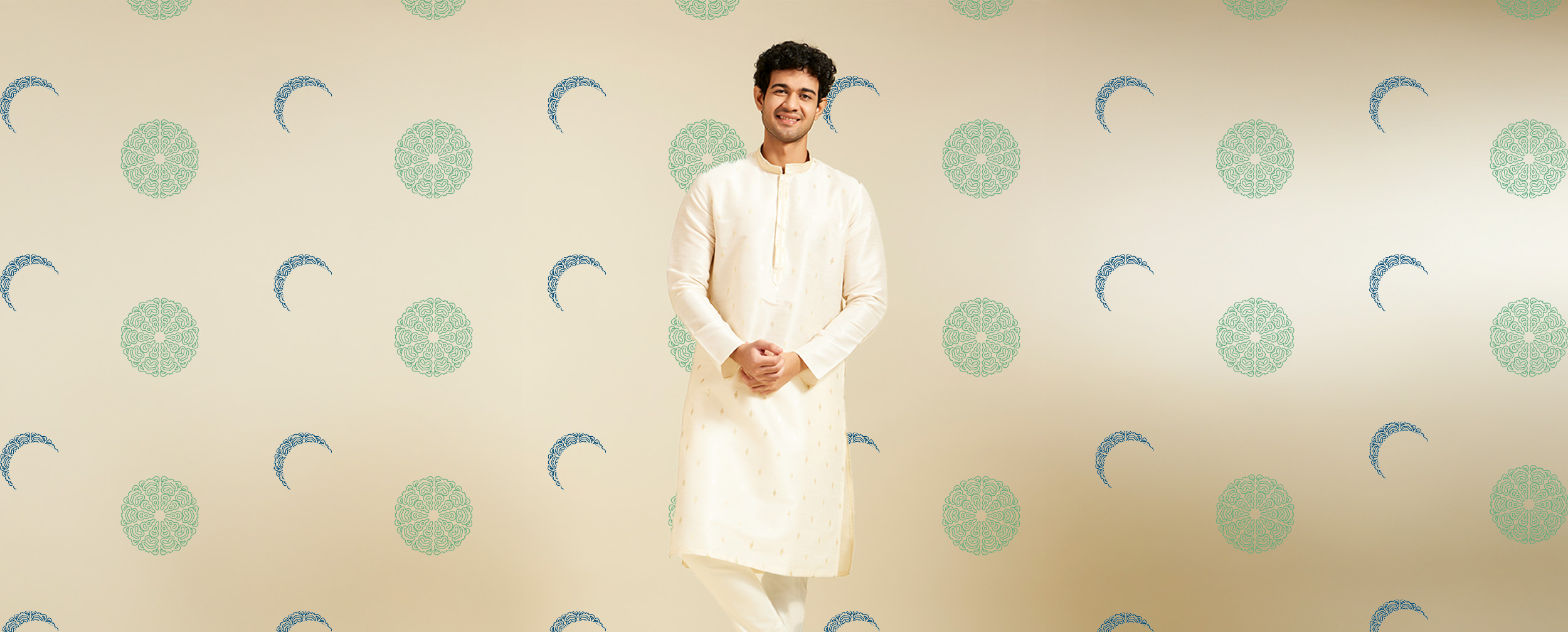 Man wearing an elegant off-white embroidered kurta, perfect for a stylish Eid outfit Man wearing an elegant off-white embroidered kurta, perfect for a stylish Eid outfit