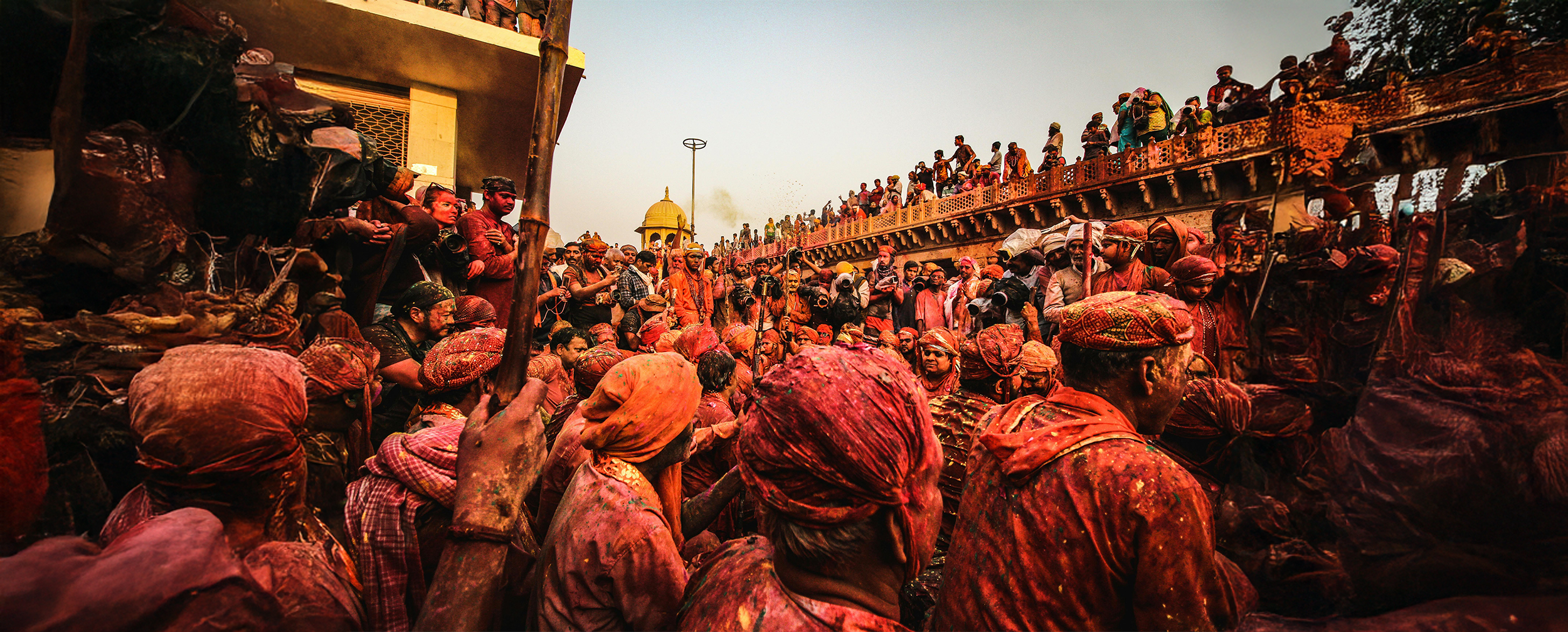 peaople gathering and celebrating pushkar holi with colours and water peaople gathering and celebrating pushkar holi with colours and water